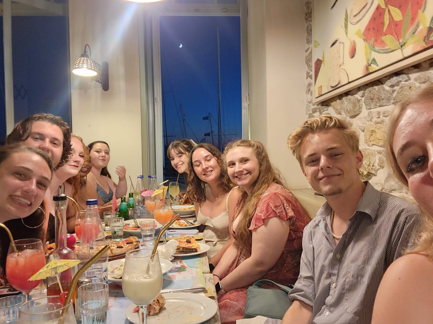 A group of students seated around a dinner table