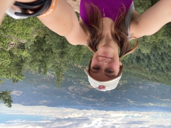 Cameron, in pigtails, takes a selfie during a hike at Independence Mountain.