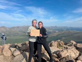 Ella and Madi posing at the top of Mount Bierstadt, a 14'er