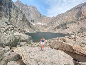 Photo of Ella in a vast rocky landscape