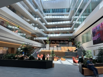 View of the AHSB atrium, a vast lobby area where four levels of the building can be seen going up.