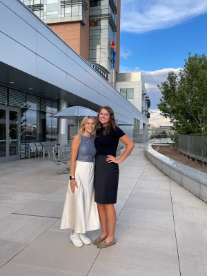 Josalin and Ella all dressed up for the intern banquet, posing outside the building