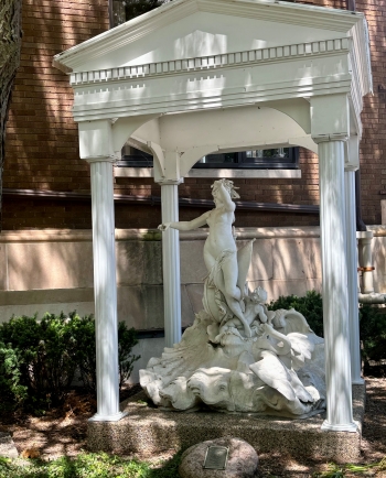 Statue within a four-column gazebo