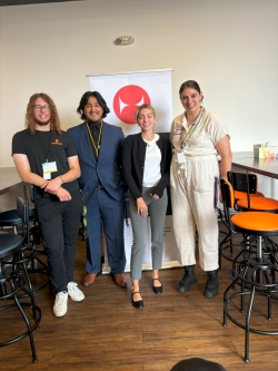 Kiana and three other interns in an indoor coffee shop venue