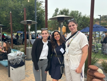 Kiana and two other interns grouped together in an outdoor park venue