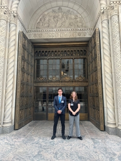 Laura and Moodi in front of a famous door entrance on the Mayo Clinic campus