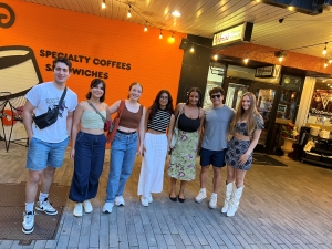 Group picture of the Mayo interns outside a coffee shop