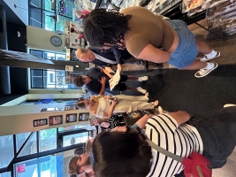 The Mayo interns and Dr. St Louis congregate inside a store