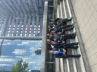 Group photo of the Mayo interns with the statues of the Mayo Brothers in front of the Mayo Clinic