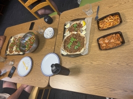 Moodi and the interns' multicultural dinner spread