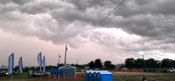 View of a rural area shed and clouds overtop providing a beautiful landscape