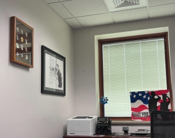 View of someone's office with a flag and other knick knacks