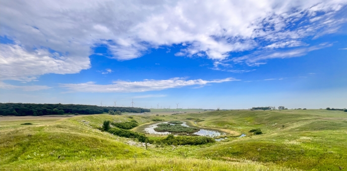 View of a valley with a small body of water nestled into it