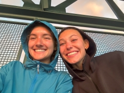 Selfie of Alyza and Ava wearing rain ponchos and smiling