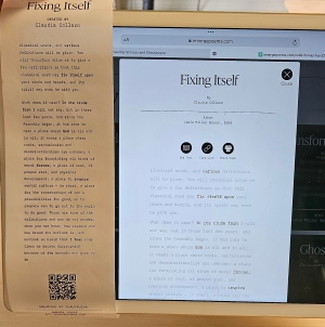 A paper version of Claudia's poem sits to the left of a computer screen showing the digital version of the same poem