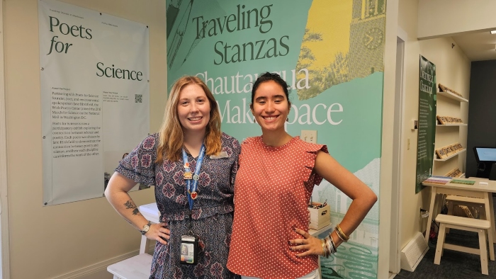 Claudia Collazo '26, pictured right, with her internship supervisor, Stephine Hunt, pictured Left. Both are about the same height and each has one armed wrapped around the other. Claudia has light brown skin and dark hair. Stephine has pale white skin and long strawberry blonde hair.