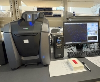 The keyence (machine left) displaying nuclear presence on aortic arch tissue (blue dots) on the computer screen