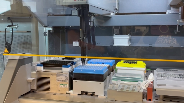 Screenshot of a robot that works to fill drug plates through sophisticated coding and engineering