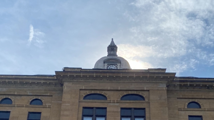 View looking up at a courthouse-looking building