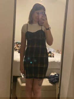 Bathroom selfie of Celina in a spaghetti strap dress showing a business casual look