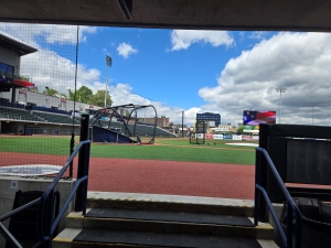View of a baseball field during the day from the dugout