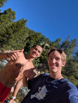 Selfie of Isaac and a friend, shirtless on a run
