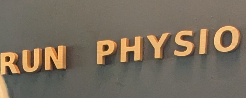 Stenciled wall decor that says Run Physio