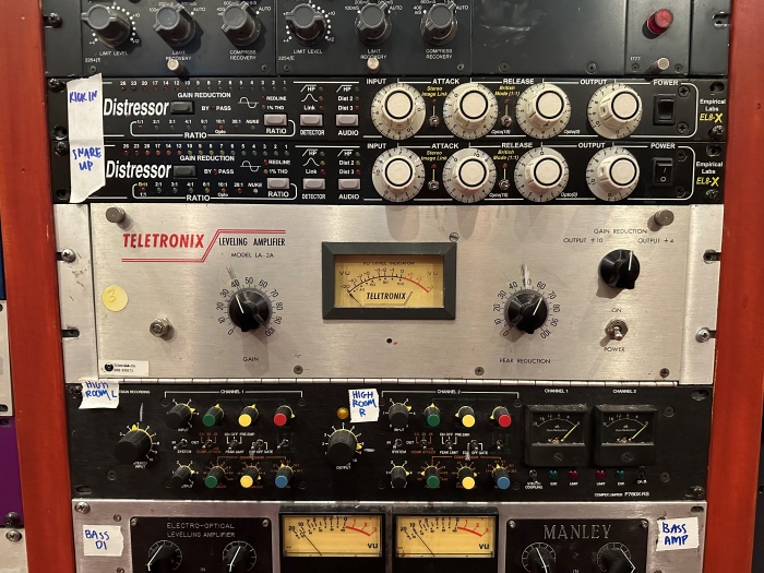 View of the old school analog tools used to record and mix sound. Lots of buttons and knobs all over the display