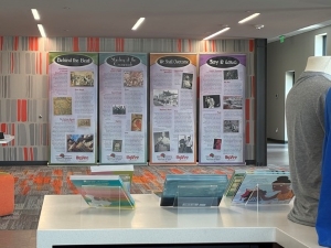 Room contains various museum exhibit items