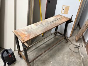 An old wooden ironing board