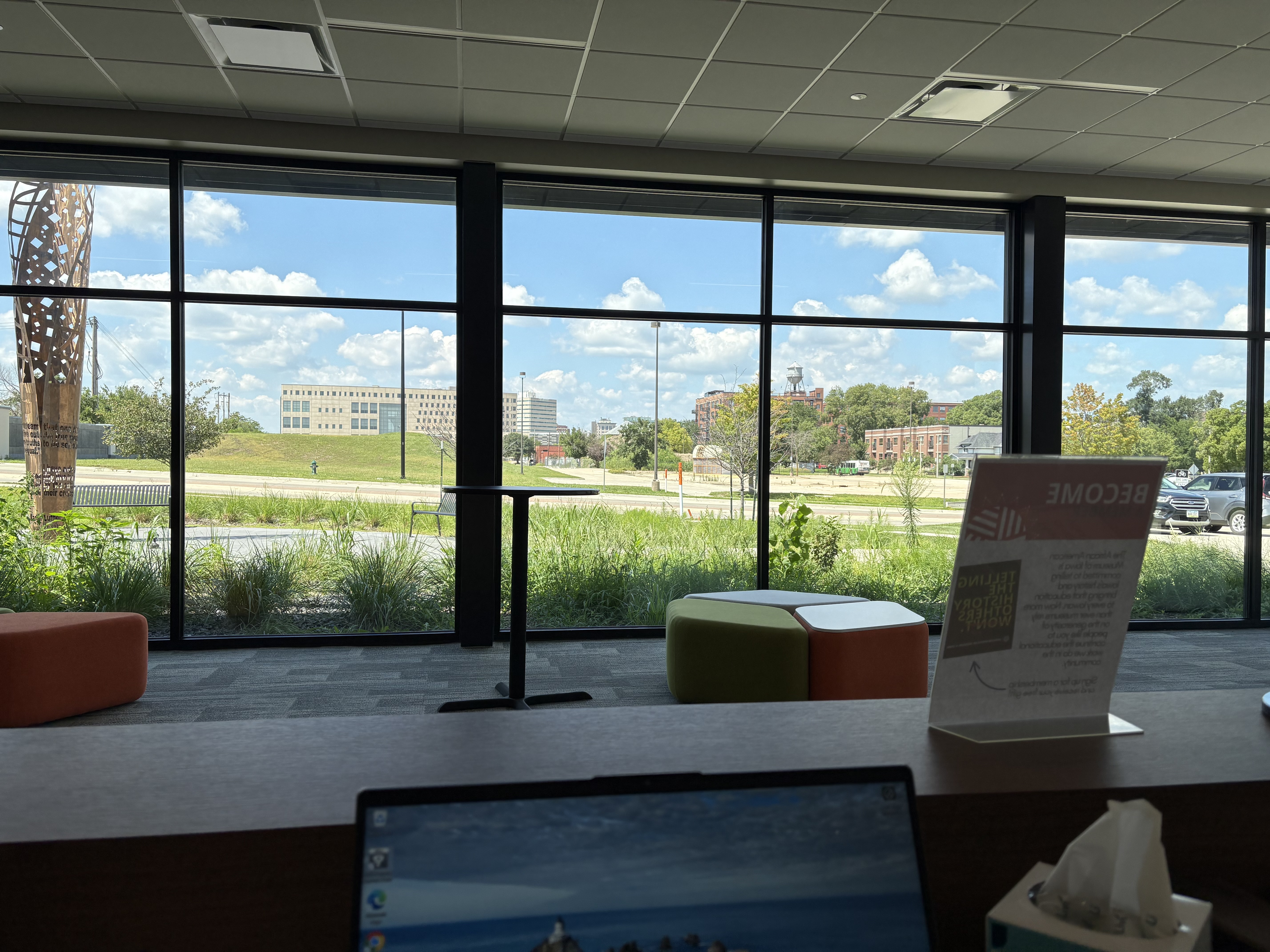 View of a beautiful sunny day outside from the front desk big windows