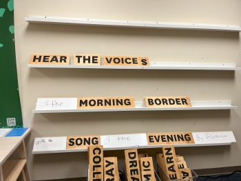View of a build-your-own poem space where someone has arranged the words and added words to create a poem that says, Hear the Voices/of the Morning Border/with the Song of the Evening by Florence.