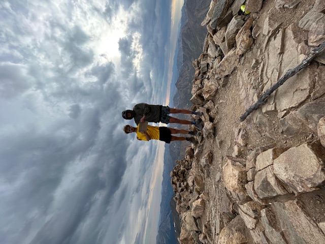 Sean and his brother Luke at the summit of a mountain theyclimbed together