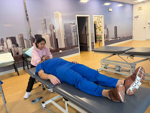 In this image I am stretching the deeper neck muscles, the physical therapist palpated on me prior, to teach me where I should feel the stretch and where to place my hands. 