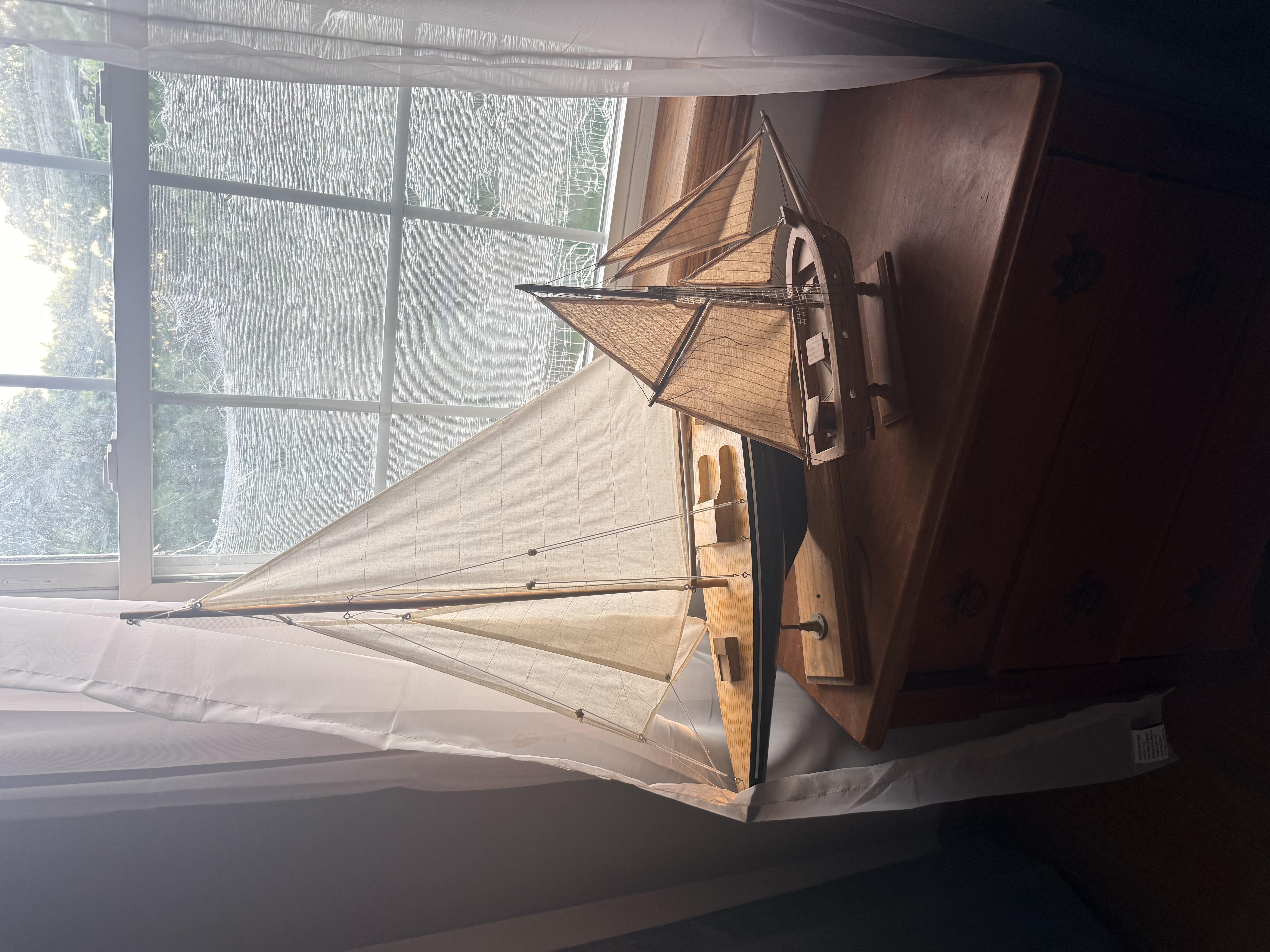 Ship decoration on a nightstand.