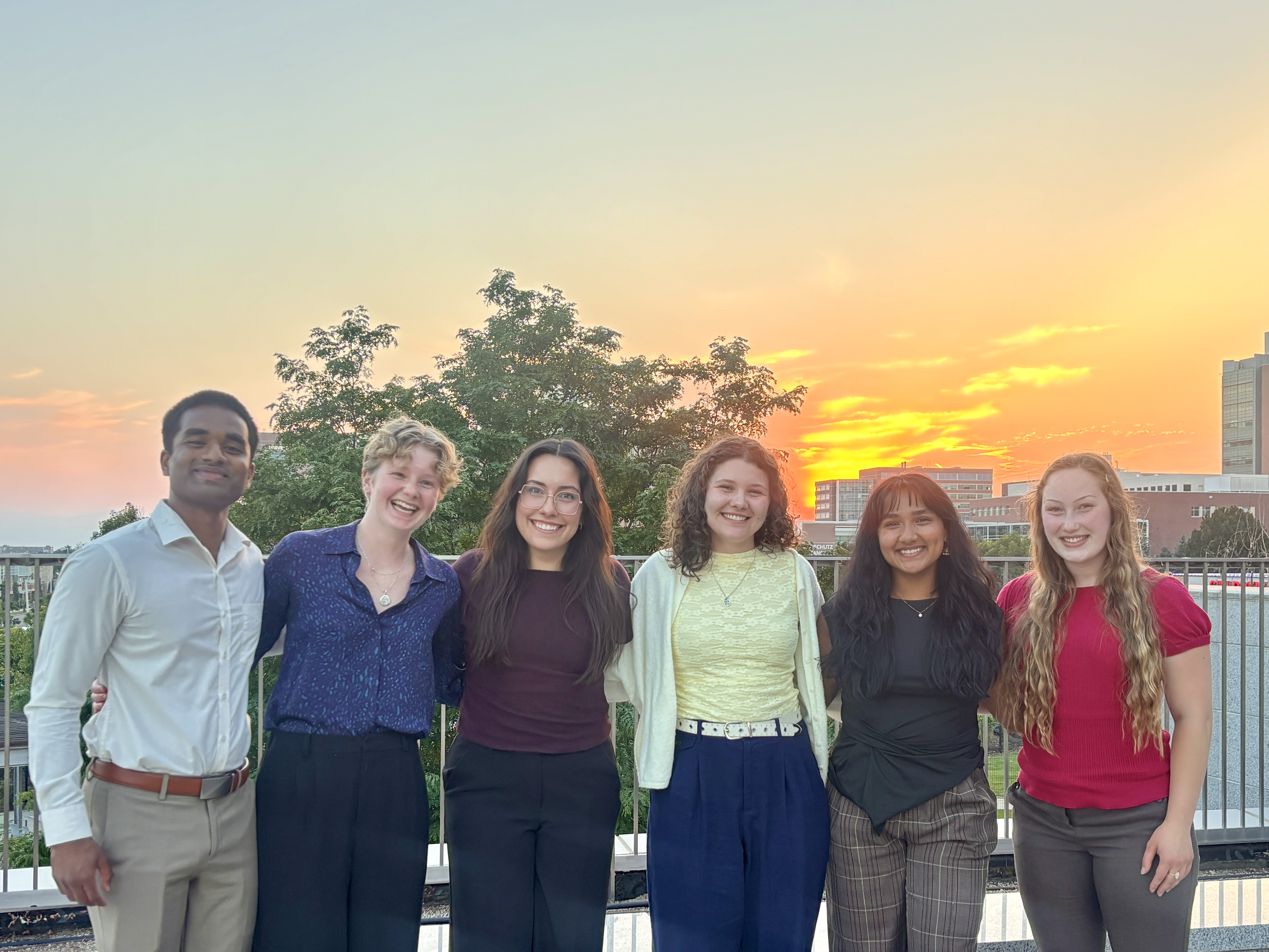 Group of interns pose together on their final day.