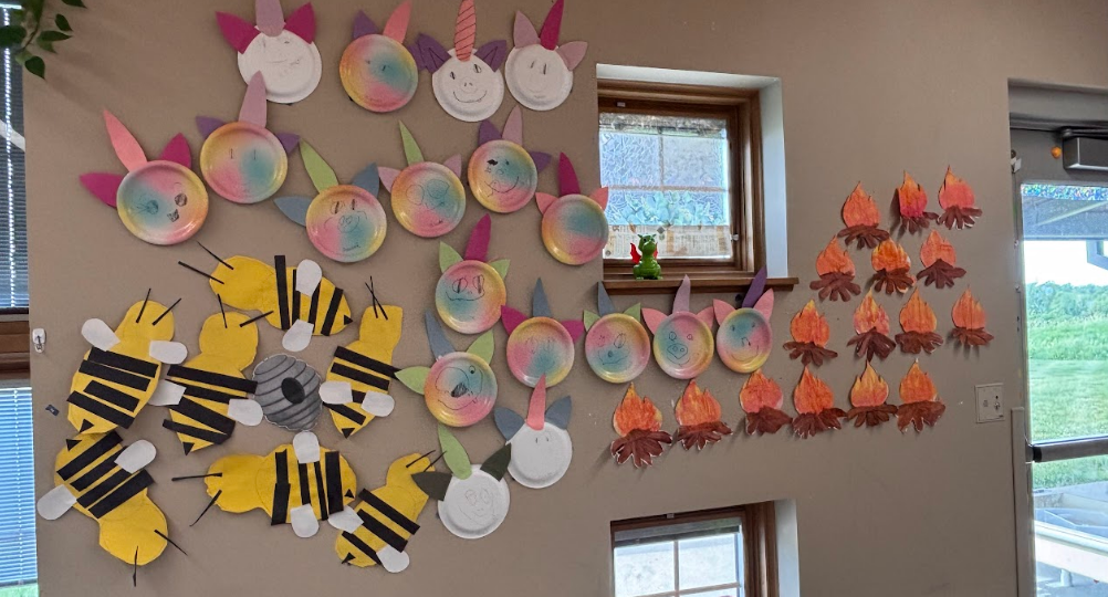 colorful children's art displayed on a wall
