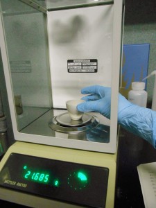 Weighing a crucible.