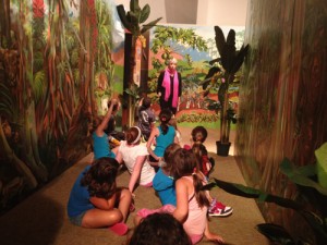 The very artist of our rainforest mural telling stories and answering questions in the exhibit. 
