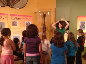 Curator Lynn Koos sharing about masks.