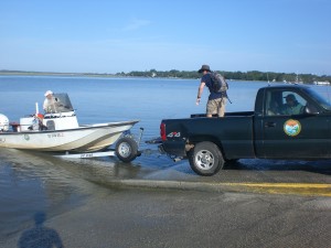 Getting the boat in the water.  From left to right - Janet, Ricky, and Erin.