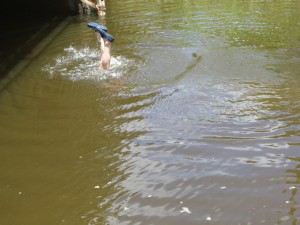 Dan diving in the channel to find the lost tube