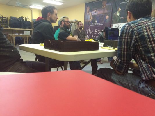 A Watson production meeting occurring after rehearsal