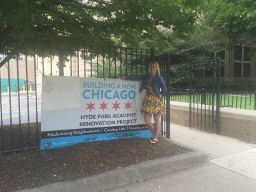 A sign outside Hyde Park Academy showing how they are helping their community just as Project Rousseau is helping the students