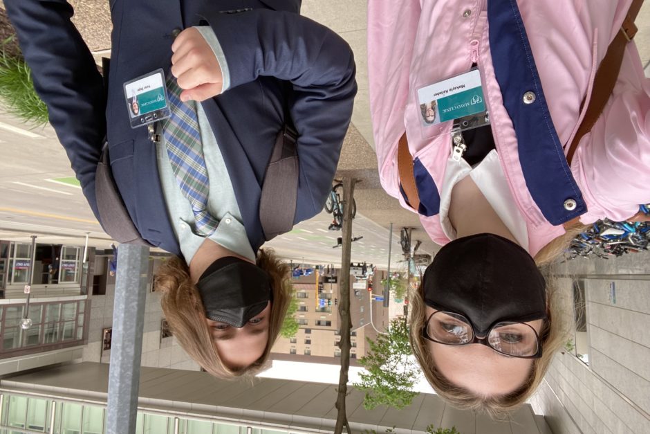 Selfie of Makayla and Nolan, both dressed smartly for their internship and wearing face masks